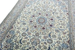Backside of handmade 2000s Nain rug showing knot structure and weave density