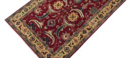 Backside of handmade New Farahan rug showing knot structure and weave density