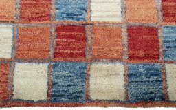 Central medallion detail of 2000s Persian Gabbeh rug from Pakistan
