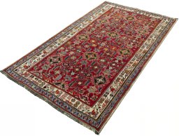 Corner detail of 2000s Shiraz rug showing border pattern and Wool pile
