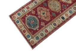 Backside of handmade New Kazak rug showing knot structure and weave density