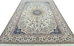 Surface texture of 2000s Nain rug with natural Wool and intricate pattern