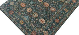 Backside of handmade New Farahan rug showing knot structure and weave density