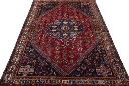 Surface texture of 2000s Shiraz rug with natural Wool and intricate pattern