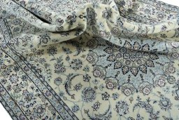 Surface texture of 2000s Nain rug with natural Wool and intricate pattern
