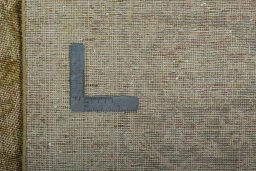 Backside of handmade 1970s Vintage rug showing knot structure and weave density
