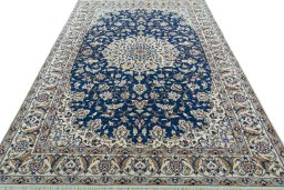 Surface texture of 2000s Nain rug with natural Wool and intricate pattern
