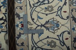 Backside of handmade 2000s Nain rug showing knot structure and weave density