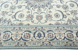Corner detail of 2000s Nain rug showing border pattern and Wool pile