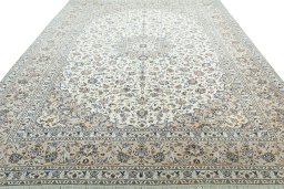 Surface texture of 2000s Kashan rug with natural Wool and intricate pattern