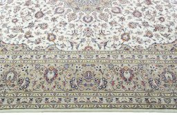 Corner detail of 2000s Kashan rug showing border pattern and Wool pile