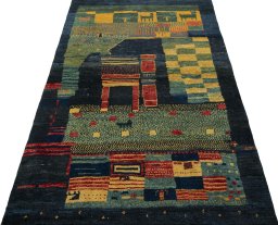 Surface texture of 2000s Persian Gabbeh rug with natural Wool and intricate pattern
