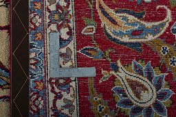 Backside of handmade 1970s Kashan rug showing knot structure and weave density