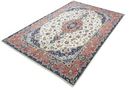 Corner detail of 2000s Kashan rug showing border pattern and Wool pile