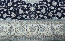 Corner detail of New Nain rug showing border pattern and Wool pile
