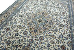 Backside of handmade 2000s Kashan rug showing knot structure and weave density