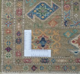 Corner detail of New Kazak rug showing border pattern and Wool pile