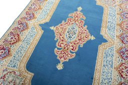 Backside of handmade 1970s Kerman rug showing knot structure and weave density