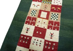 Backside of handmade 2000s Persian Gabbeh rug showing knot structure and weave density