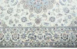 Corner detail of 2000s Nain rug showing border pattern and Wool pile