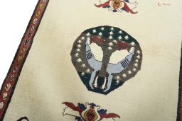 Backside of handmade 2000s Persian Gabbeh rug showing knot structure and weave density