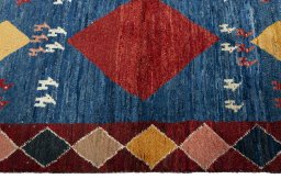 Close-up detail of 2000s Persian Gabbeh rug from Pakistan showing Wool weave