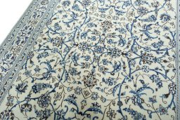 Backside of handmade 2000s Nain rug showing knot structure and weave density