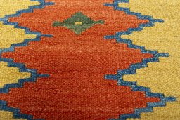 Backside of handmade New Modern Design rug showing knot structure and weave density