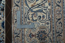 Backside of handmade 2000s Kashmar rug showing knot structure and weave density