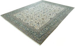 Corner detail of 2000s Kashan rug showing border pattern and Wool pile