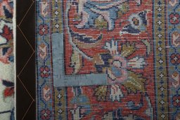 Backside of handmade 2000s Sarough rug showing knot structure and weave density