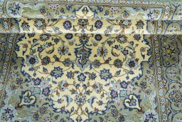 Close-up detail of 2000s Kashan rug from Iran / Persia showing Wool weave