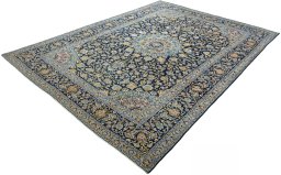 Corner detail of 2000s Kashan rug showing border pattern and Wool pile