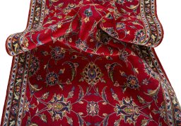 Close-up detail of 2000s Kashan rug from Iran / Persia showing Wool weave