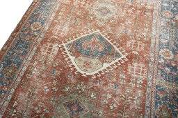 Backside of handmade 1930s Heriz rug showing knot structure and weave density