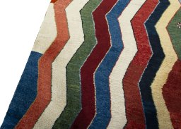 Backside of handmade 2000s Persian Gabbeh rug showing knot structure and weave density