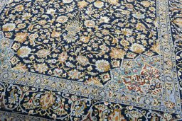 Close-up detail of 2000s Kashan rug from Iran / Persia showing Wool weave