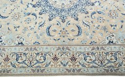 Corner detail of 2000s Nain rug showing border pattern and Wool pile