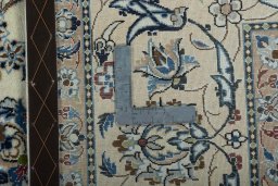 Backside of handmade 2000s Nain rug showing knot structure and weave density