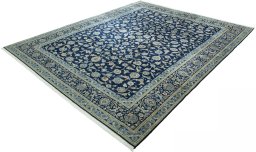 Corner detail of 2000s Kashan rug showing border pattern and Wool pile
