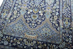 Close-up detail of 2000s Kashan rug from Iran / Persia showing Wool weave