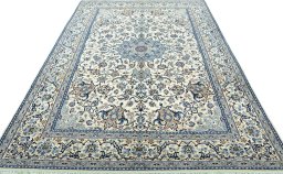 Surface texture of 2000s Nain rug with natural Wool and intricate pattern