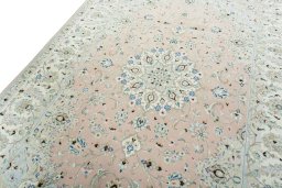 Backside of handmade New Kashan rug showing knot structure and weave density