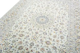 Backside of handmade 2000s Kashan rug showing knot structure and weave density
