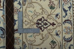 Backside of handmade 2000s Nain rug showing knot structure and weave density
