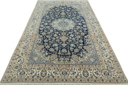Surface texture of 2000s Nain rug with natural Wool and intricate pattern