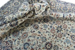 Surface texture of 2000s Kashan rug with natural Wool and intricate pattern