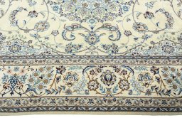 Corner detail of 2000s Nain rug showing border pattern and Wool pile