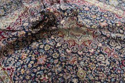 Surface texture of 1970s Kerman rug with natural Wool and intricate pattern