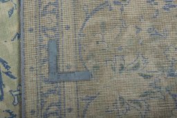 Surface texture of 1970s Vintage rug with natural Wool and intricate pattern